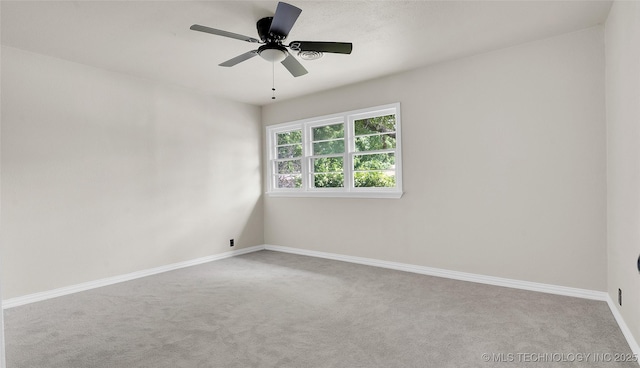 711 NW Elizabeth St, Ardmore, OK 73401 - empty room featuring ceiling fan and light carpet