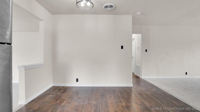 711 NW Elizabeth St, Ardmore, OK 73401 - spare room featuring dark wood-type flooring