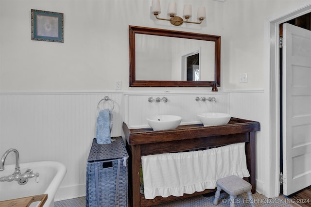 bathroom with a bathtub and vanity