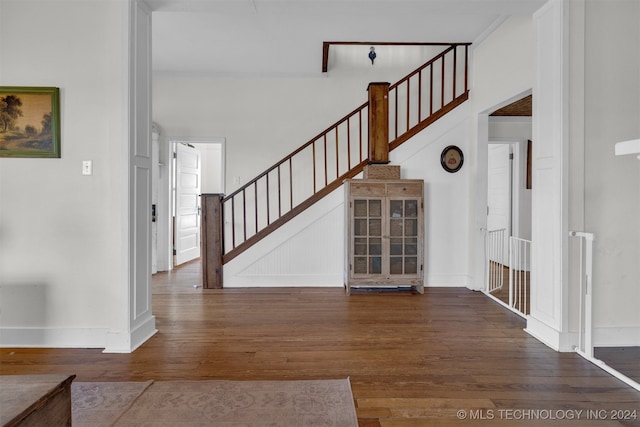 unfurnished living room with wood-type flooring