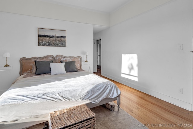 bedroom featuring hardwood / wood-style floors