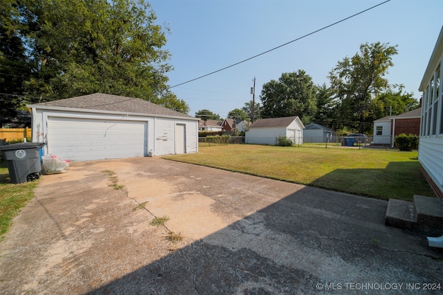 garage featuring a yard