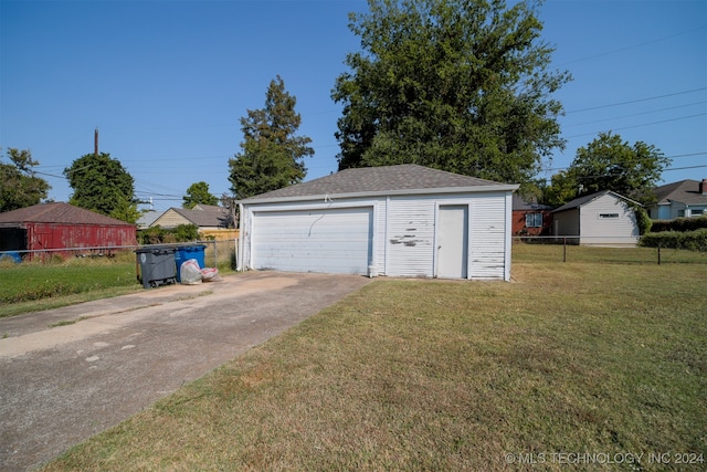 garage featuring a yard