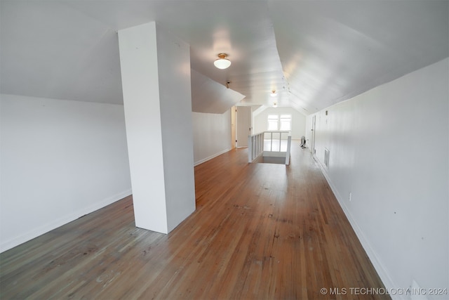 bonus room featuring lofted ceiling and wood-type flooring