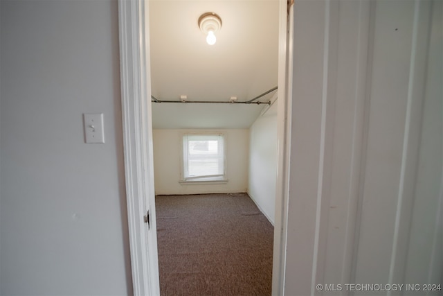 hall featuring light colored carpet