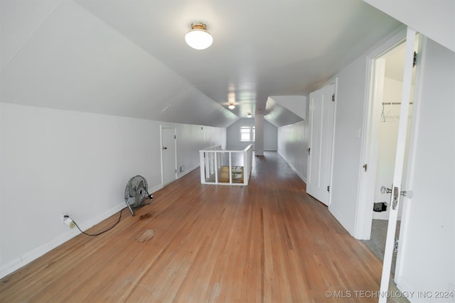 bonus room featuring hardwood / wood-style flooring and lofted ceiling