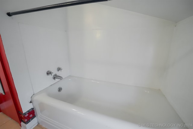 bathroom featuring a bathtub and tile patterned flooring