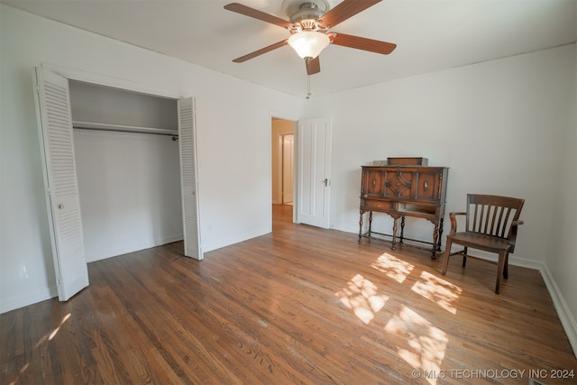 interior space featuring ceiling fan and dark wood-type flooring