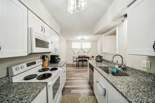 kitchen with white cabinets, stone counters, dark wood-type flooring, and white appliances