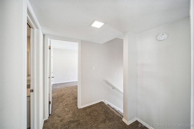 hallway featuring carpet