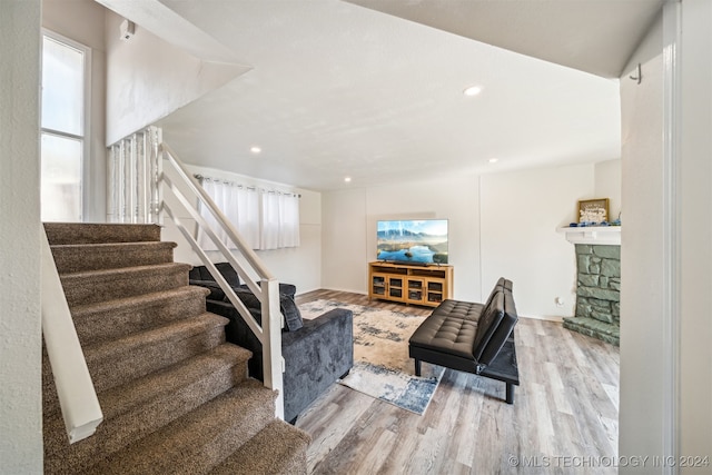 living room with a fireplace and light hardwood / wood-style floors