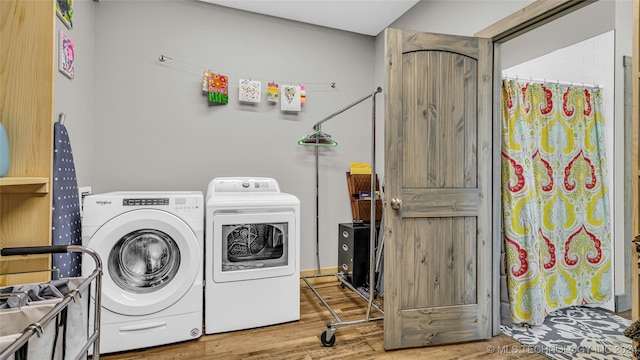 6126 Kings Rd, Ardmore, OK 73401 - washroom featuring washer and dryer and wood finished floors