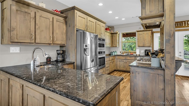 6126 Kings Rd, Ardmore, OK 73401 - kitchen featuring stainless steel fridge with ice dispenser, a sink, recessed lighting, a peninsula, and healthy amount of natural light
