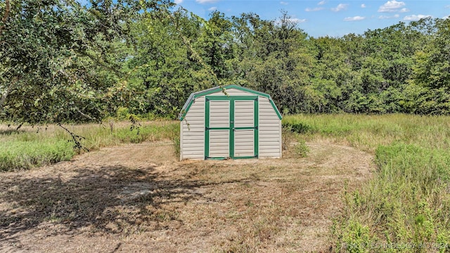 6126 Kings Rd, Ardmore, OK 73401 - view of shed featuring a wooded view