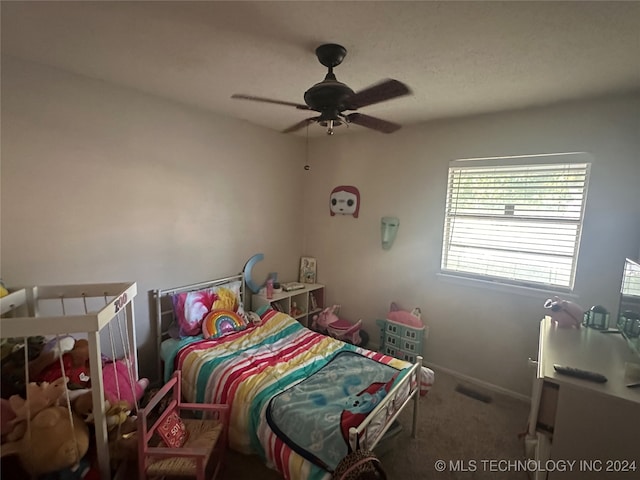 carpeted bedroom featuring ceiling fan