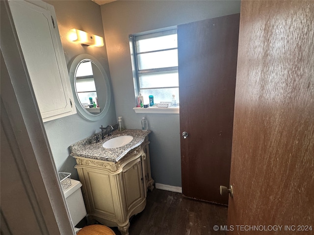 bathroom featuring vanity and hardwood / wood-style floors