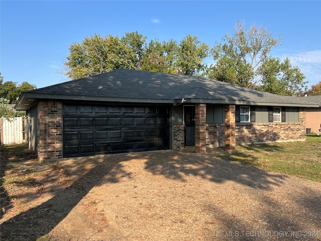 ranch-style home with a garage