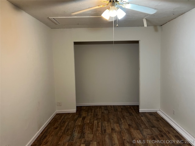 spare room featuring dark hardwood / wood-style floors and ceiling fan