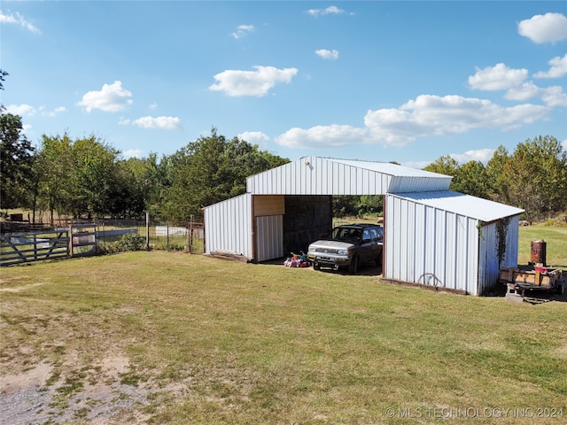 view of outdoor structure with a lawn