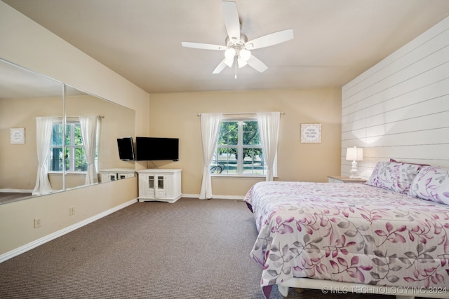 bedroom featuring carpet floors, multiple windows, and ceiling fan