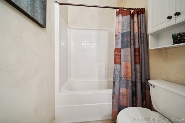 bathroom with shower / tub combo and toilet