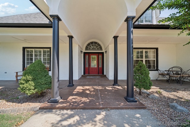 doorway to property with a porch