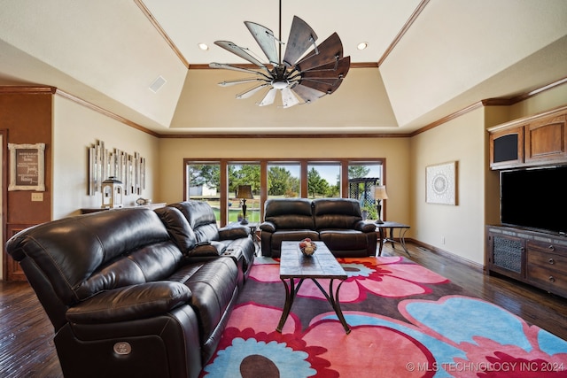 living room with ornamental molding, a wealth of natural light, vaulted ceiling, and dark hardwood / wood-style flooring