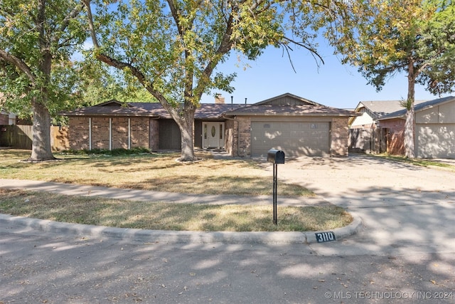 ranch-style house featuring a garage