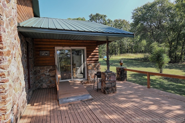 deck featuring a lawn