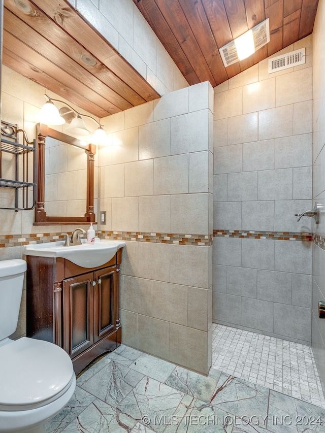 bathroom with vanity, wood ceiling, lofted ceiling, tile walls, and toilet