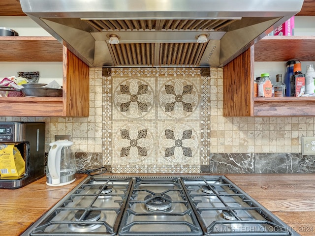 kitchen featuring open shelves, custom range hood, and backsplash