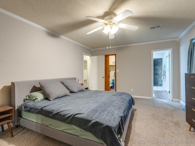 bedroom featuring visible vents, baseboards, ornamental molding, a ceiling fan, and carpet flooring