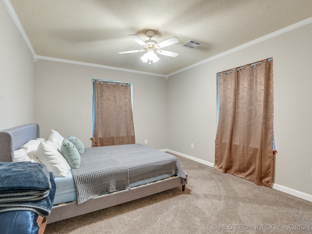 carpeted bedroom with crown molding, a textured ceiling, and ceiling fan