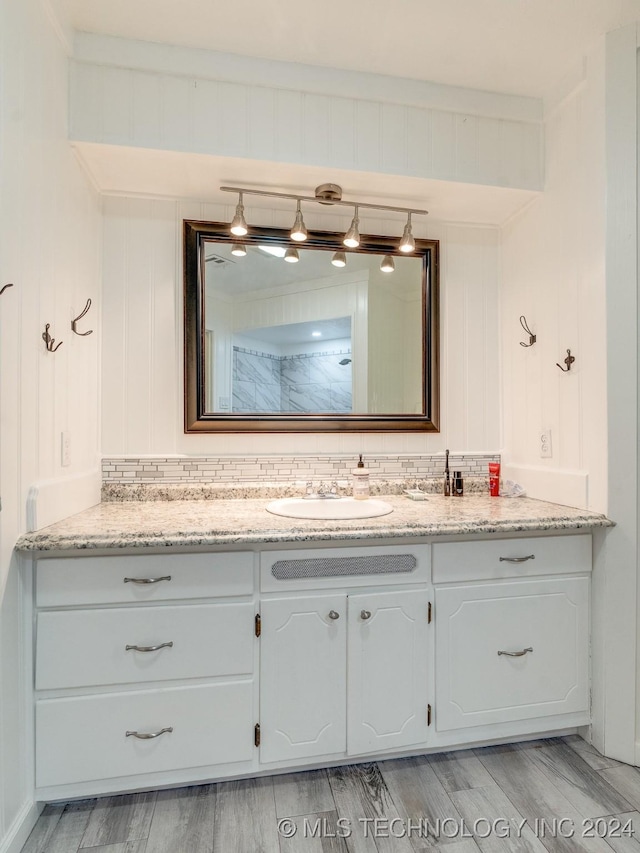 bathroom featuring vanity and wood finished floors