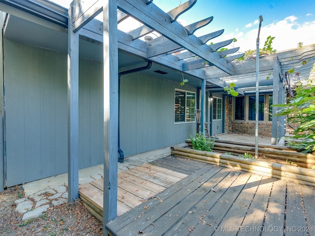 wooden terrace featuring a pergola