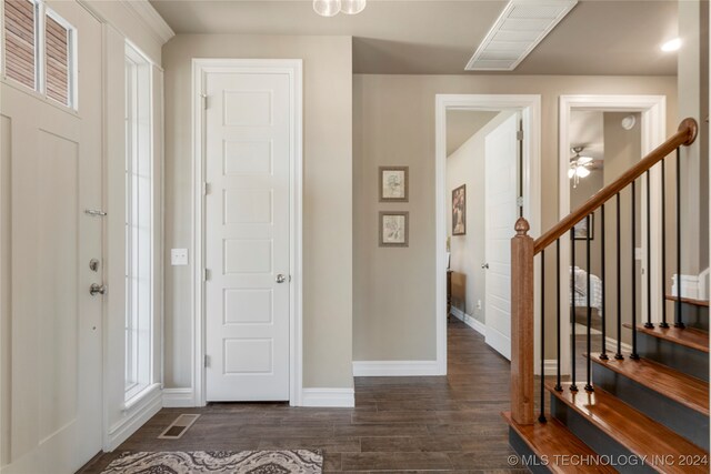 entrance foyer featuring dark hardwood / wood-style flooring and ceiling fan