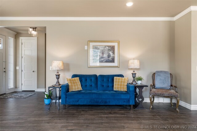 living room with ornamental molding and dark hardwood / wood-style flooring