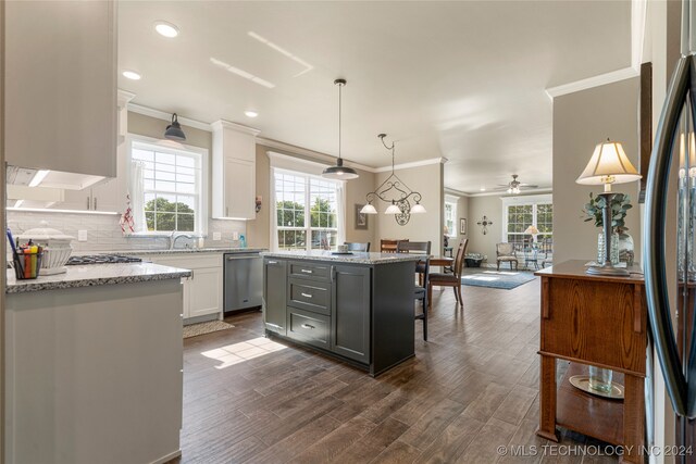 kitchen featuring white cabinets, gray cabinetry, stainless steel appliances, dark hardwood / wood-style floors, and a center island