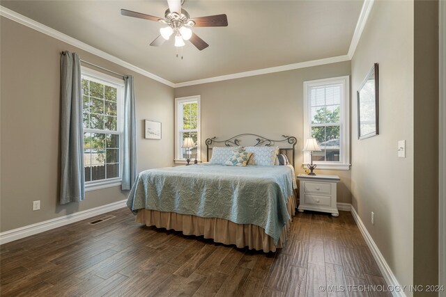 bedroom featuring multiple windows, ceiling fan, and dark wood-type flooring