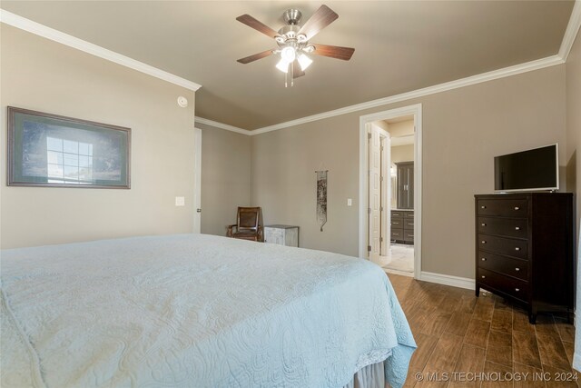 bedroom featuring dark hardwood / wood-style floors, crown molding, and ceiling fan