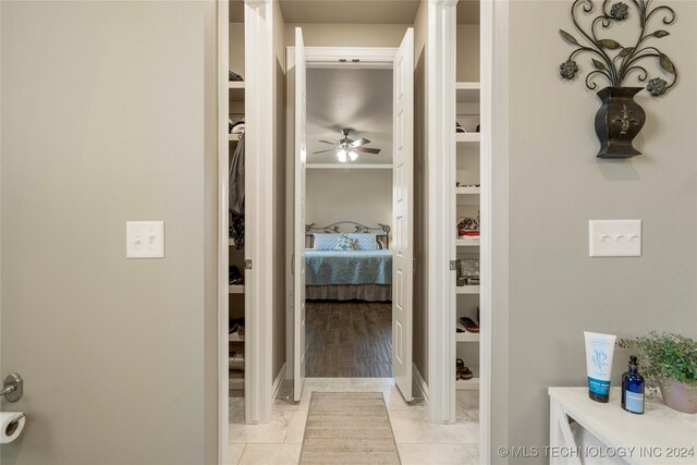 bathroom featuring tile patterned flooring and ceiling fan