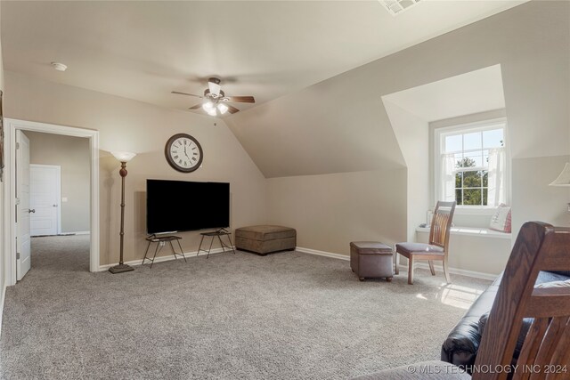 bonus room featuring lofted ceiling, ceiling fan, and carpet