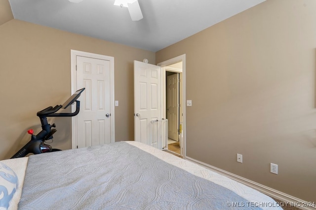 unfurnished bedroom featuring ceiling fan and lofted ceiling