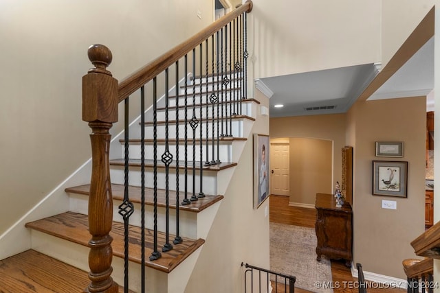 stairway with wood-type flooring