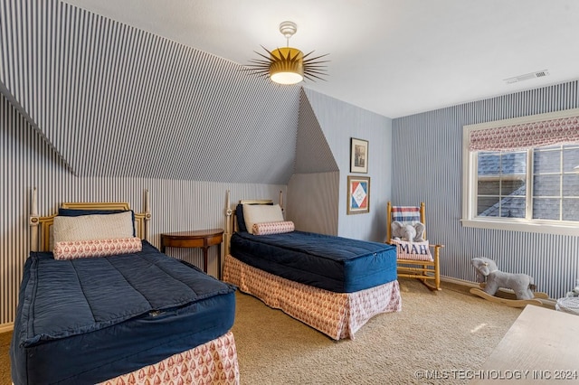 bedroom with vaulted ceiling and carpet