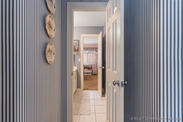 corridor featuring light tile patterned flooring