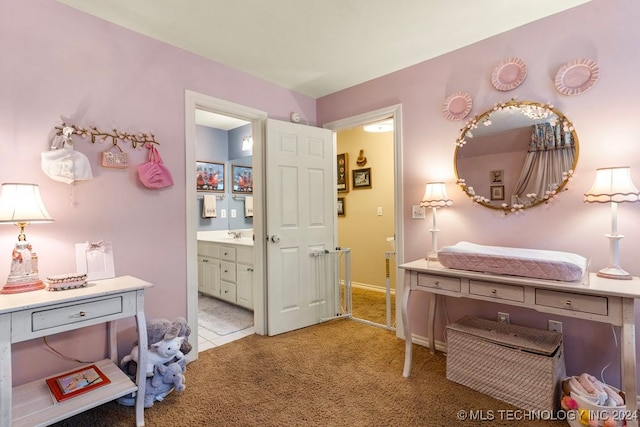 carpeted bedroom with ensuite bathroom