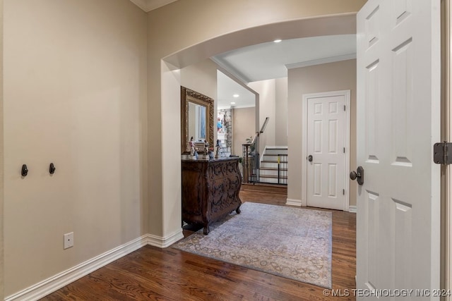 hall featuring crown molding and wood-type flooring