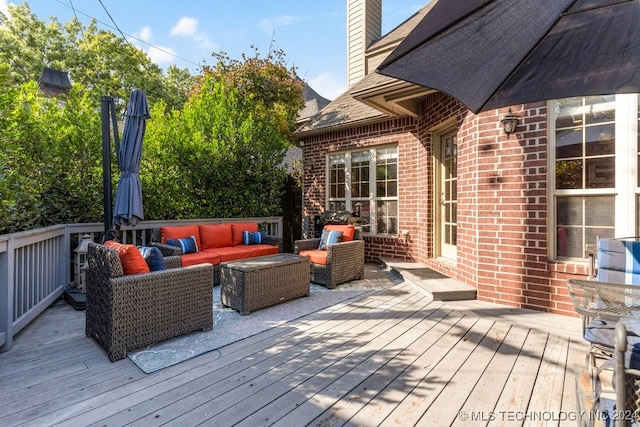 wooden deck featuring an outdoor hangout area