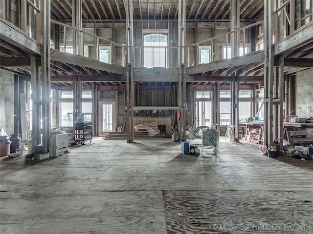 miscellaneous room with a towering ceiling